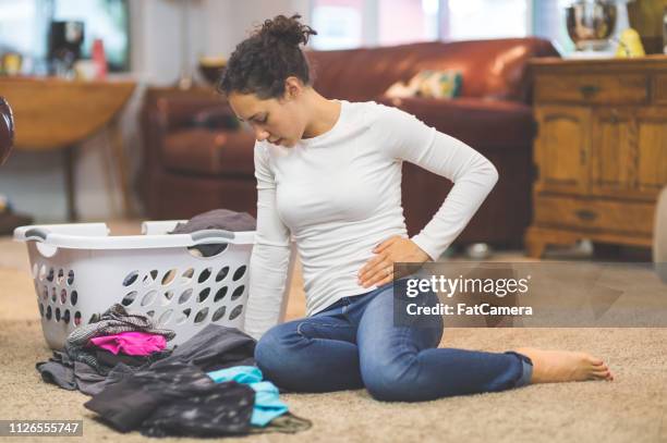 young woman with pelvic pain - crotch stock pictures, royalty-free photos & images