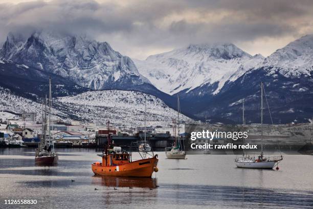 boats moored in a frigid landscape - tierra del fuego province chile stock pictures, royalty-free photos & images