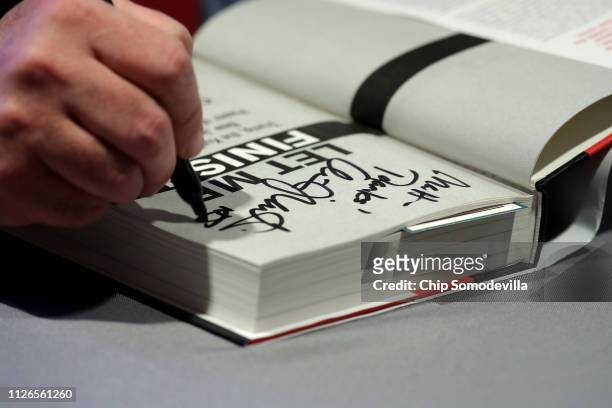 Former New Jersey Governor Chris Christie signs copies of his new book at The Washington Post January 31, 2019 in Washington, DC. In the book titled,...