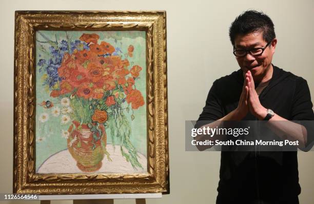 Wang Zhongjun, Chairman of Huayi Brothers Media, speaks during a ceremony to receive the painting of Vincent van Gogh's " Vase with Daisies and...