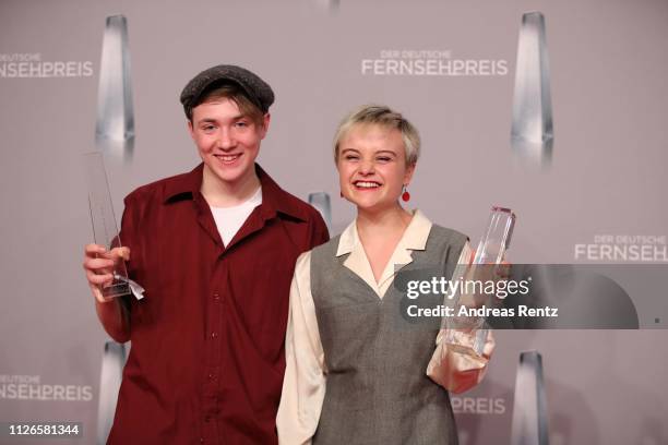 Lena Urzendowsky and Michelangelo Fortuzzi pose with their awards as best newcomer during the German Television Award at Rheinterrasse on January 31,...