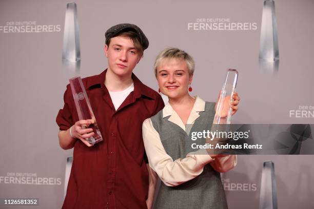 Lena Urzendowsky and Michelangelo Fortuzzi pose with their awards as best newcomer during the German Television Award at Rheinterrasse on January 31,...