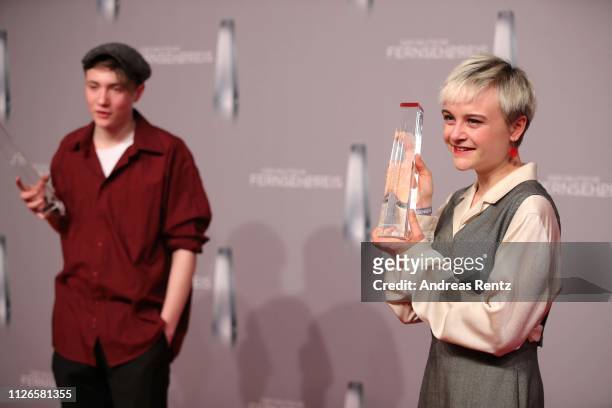Lena Urzendowsky and Michelangelo Fortuzzi pose with their awards as best newcomer during the German Television Award at Rheinterrasse on January 31,...