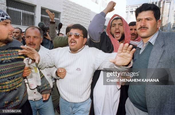 Palestinians call for revenge on February 25, 1994 during heavy riots that erupted following the Cave of the Patriarchs massacre carried out by...