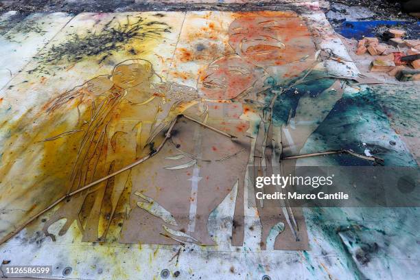 View of the artistic performance, after the explosion, "In The Volcano", by the artist Cai Guo Qiang, and paintings created by color powders and...