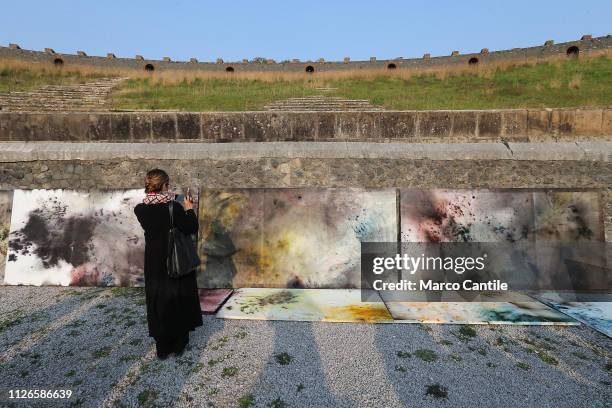 View of the artistic performance, after the explosion, "In The Volcano", by the artist Cai Guo Qiang, and paintings created by color powders and...