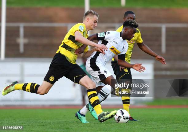 Amos Pieper of Borussia Dortmund II, Charalambos Makridis of Borussia Moenchengladbach II and Denzeil Boadu of Borussia Dortmund II battle for the...