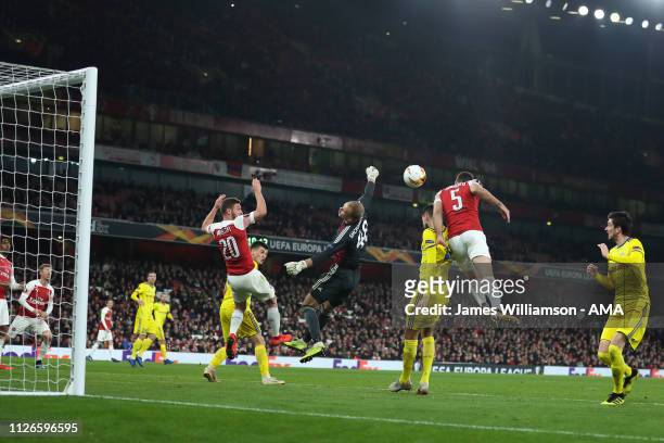 Sokratis Papastathopoulos of Arsenal scores a goal to make it 3-0 and 3-1 on Aggregate during the UEFA Europa League Round of 32 Second Leg match...