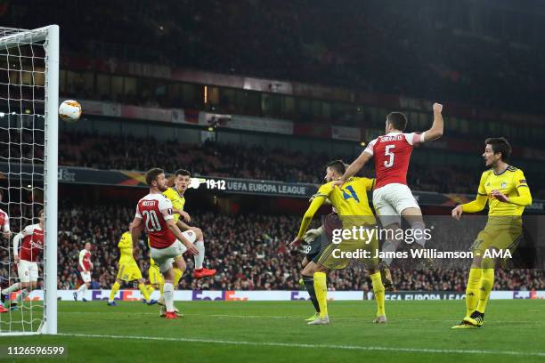 Sokratis Papastathopoulos of Arsenal scores a goal to make it 3-0 and 3-1 on Aggregate during the UEFA Europa League Round of 32 Second Leg match...