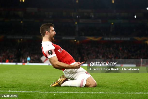 Sokratis of Arsenal celebrates scoring his team third goal during the UEFA Europa League Round of 32 Second Leg match between Arsenal FC and Bate...