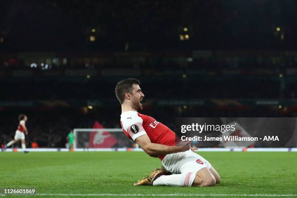 Sokratis Papastathopoulos of Arsenal celebrates after scoring a goal to make it 3-0 and 3-1 on Aggregate during the UEFA Europa League Round of 32...