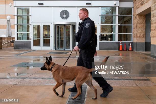 Homeland Security Police Officer patrols outside the US Court House in Greenbelt, MD, on February 21 as US Coast Guard Lt. Christopher Hasson of...