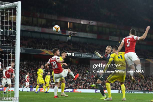 Sokratis Papastathopoulos of Arsenal scores a goal to make it 3-0 and 3-1 on Aggregate during the UEFA Europa League Round of 32 Second Leg match...