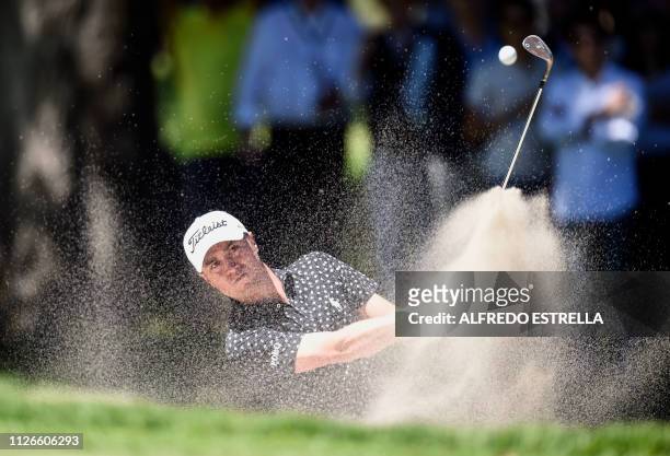 Golfer Justin Thomas plays his shot from the 10th green, during the first round of the World Golf Championship, in Mexico City on February 21, 2019....