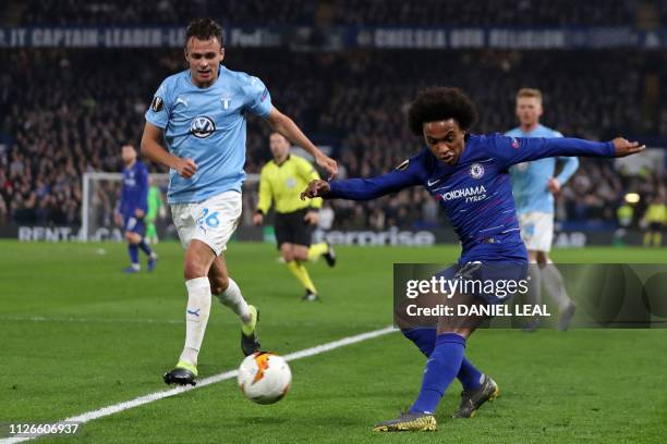 Chelsea's Brazilian midfielder Willian crosses the ball during the UEFA Europa League round of 32, 2nd leg football match between Chelsea and Malmo...