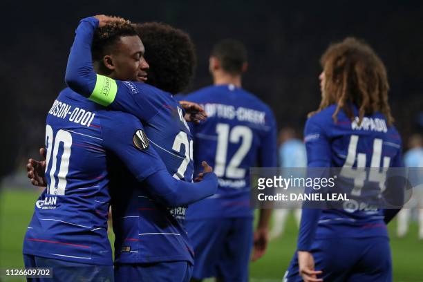Chelsea's English midfielder Callum Hudson-Odoi celebrates with teammates after scoring their third goal during the UEFA Europa League round of 32,...