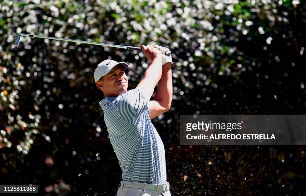 Golfer Tiger Woods plays his shot at tee 3 during the first round of the World Golf Championship in Mexico City, at Chapultepec's Golf Club in Mexico...