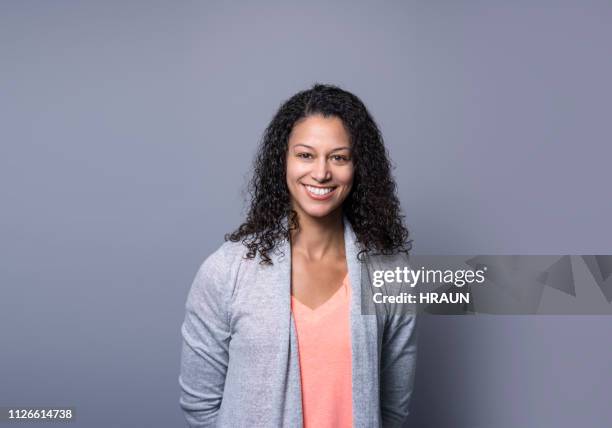 successful manager smiling on gray background - executive board portrait session stock pictures, royalty-free photos & images