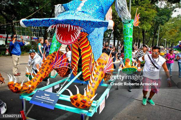 a parade of the traditional alebrijes during the day of the dead celebrations in the center of mexico city - alebrije stock pictures, royalty-free photos & images