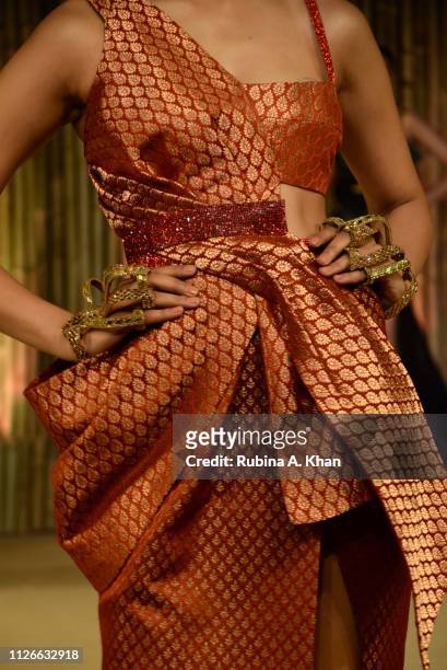 Models walk in garments created by fifteen Indian designers from textiles made by women from self-help groups across Asia at the World Bank...