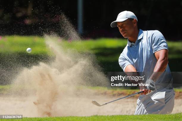 Tiger Woods of United States plays his shot from the 18th tee during the first round of World Golf Championships-Mexico Championship at Club de Golf...