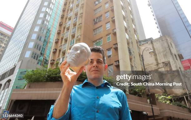 David Hanson, Founder and president of Hanson Robotics, poses with a..., News Photo