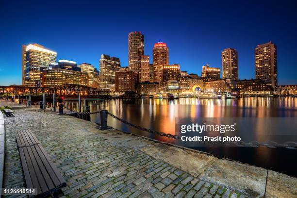 boston harbor and financial district at night in boston, massachusetts, usa. - boston massachusetts imagens e fotografias de stock