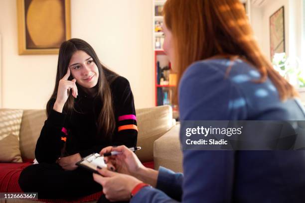 teenage girl at psychotherapy - mental alertness stock pictures, royalty-free photos & images