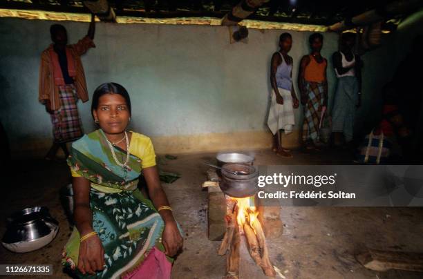 Muria People in Chhattisgarh State. Young Muria at the entrance of a gothul, a dormitory where boys and girls sleep, work, mingle and experiment with...