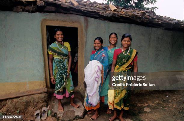 Muria People in Chhattisgarh State. Young Muria at the entrance of a gothul, a dormitory where boys and girls sleep, work, mingle and experiment with...