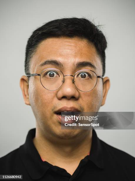 real chinese man with surprised expression - shock face stock pictures, royalty-free photos & images