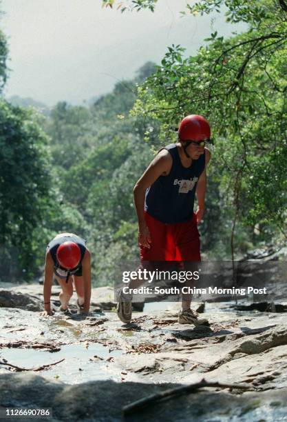 Teenagers taking part in the Bonaqua Youth Challenge in the Tai Tam Country Park. 18 January 2003