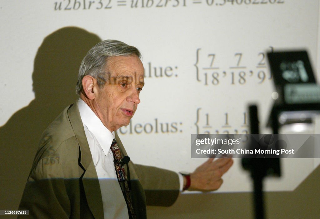 Nobel prize-winning mathematics genius John Nash of Princeton University works through his notes on game theory at the University of Hong Kong. 18 February 2003