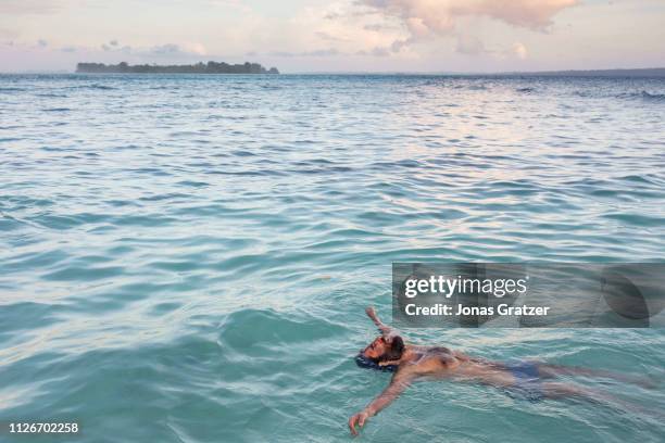 Asylum seeker Behrouz Boochani flooting in the Pacific ocean next to Manus island. The human cost of Australias offshore detention policy has been...