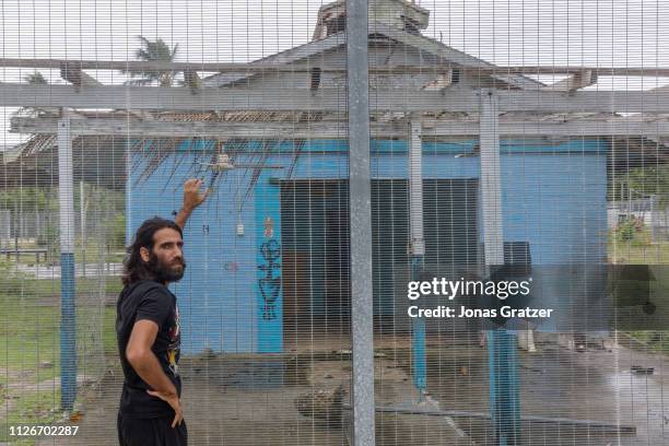 Asylum seeker Behrouz Boochani, stands outside the abandoned naval base on Manus island, where he and other asylum seekers were locked up for the...