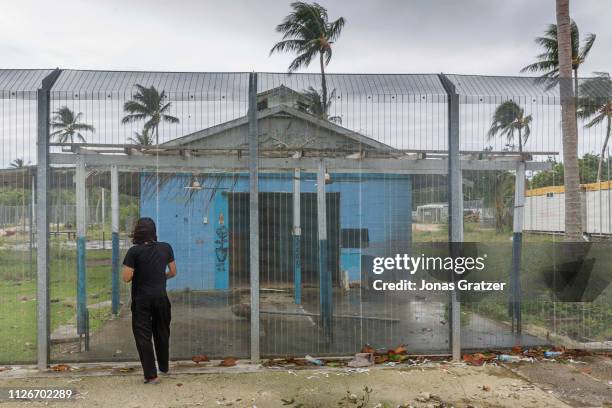 Asylum seeker Behrouz Boochani, stands outside the abandoned naval base on Manus island, where he and other asylum seekers were locked up for the...