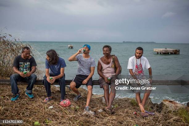 The two Kurdish Asylum seekers Behrouz Boochani and Ari Sirwan hanging out with locals on Manus island and drinking beer. The human cost of...
