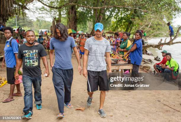 Asylum seekers Behrouz Boochani and Ari Sirwan walking trough a local market on the island of Manus. The human cost of Australias offshore detention...