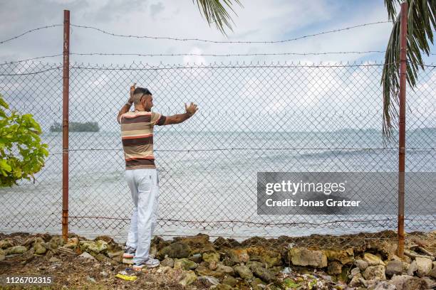 Pakistani asylum seeker, Shabbir Hossein looks out over the ocean. He fled the Taliban in his native country and was hopping to find sanctuary in...