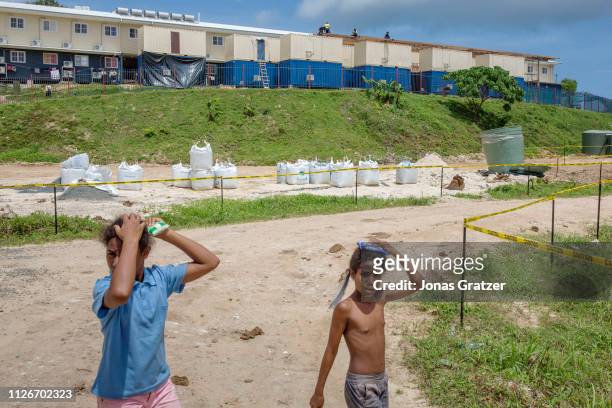 Children bypassing the barracks where the asylum seekers are living on Manus Island. The human cost of Australias offshore detention policy has been...