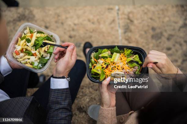 business lunch break in chicago downtown - salad to go stock pictures, royalty-free photos & images