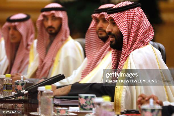 Saudi Crown Prince Mohammed bin Salman attends a meeting with Chinese President Xi Jinping at the Great Hall of the People in Beijing on February 22,...