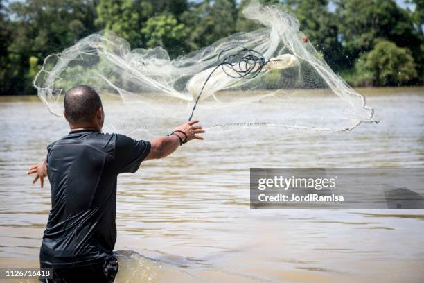 native fisherman with rai - catching fish stock pictures, royalty-free photos & images