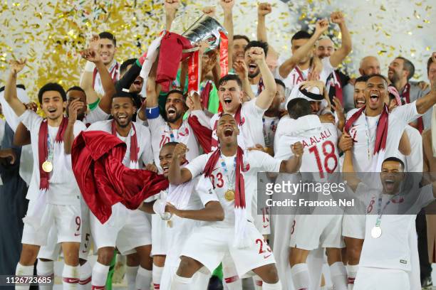 Players of Qatar lifts the AFC Asian Cup trophy following their victory in the AFC Asian Cup final match between Japan and Qatar at Zayed Sports City...