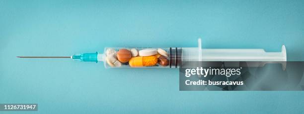 syringe and pill - safe injecting stock pictures, royalty-free photos & images