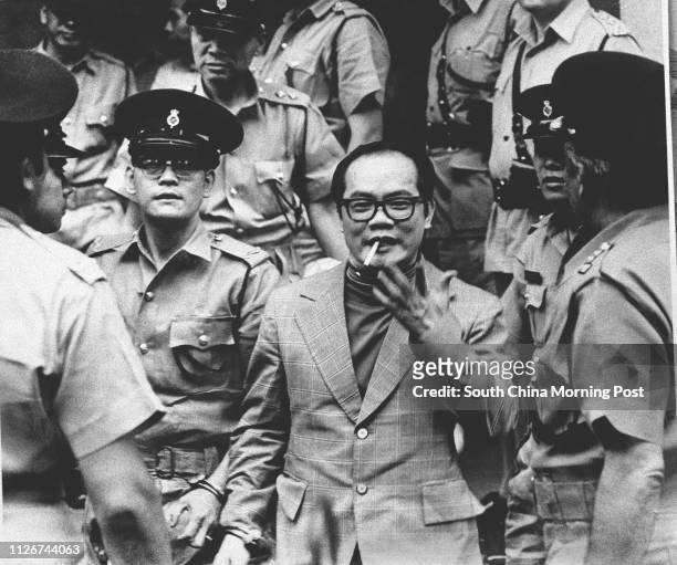 Ng Sik-ho, nicknamed Limpy Ho, being escorted by police. The drug tsar and triad boss was sentenced to 30 years' imprisonment in 1975 for drug...