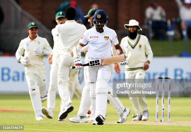 Lahiru Thirimanne of Sri Lanka walks off as South Africa celebrate the wicket during day 2 of the 2nd Castle Lager Test match between South Africa...