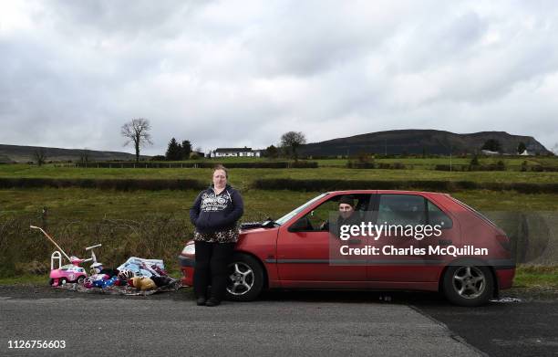 Stella Lynne and William Andrews pose for a photograph as they take part in the weekly market that takes place on the Irish border on February 17,...