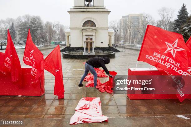 Member of the pro-Russian socialist party prepare for a political rally as voters will cast their ballot on sunday during the parliamentary elections...