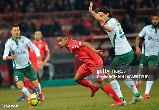 Dijon's French forward Wesley Said vies with Saint-Etienne's Serbian defender Neven Subotic during the French L1 football match between Dijon and...